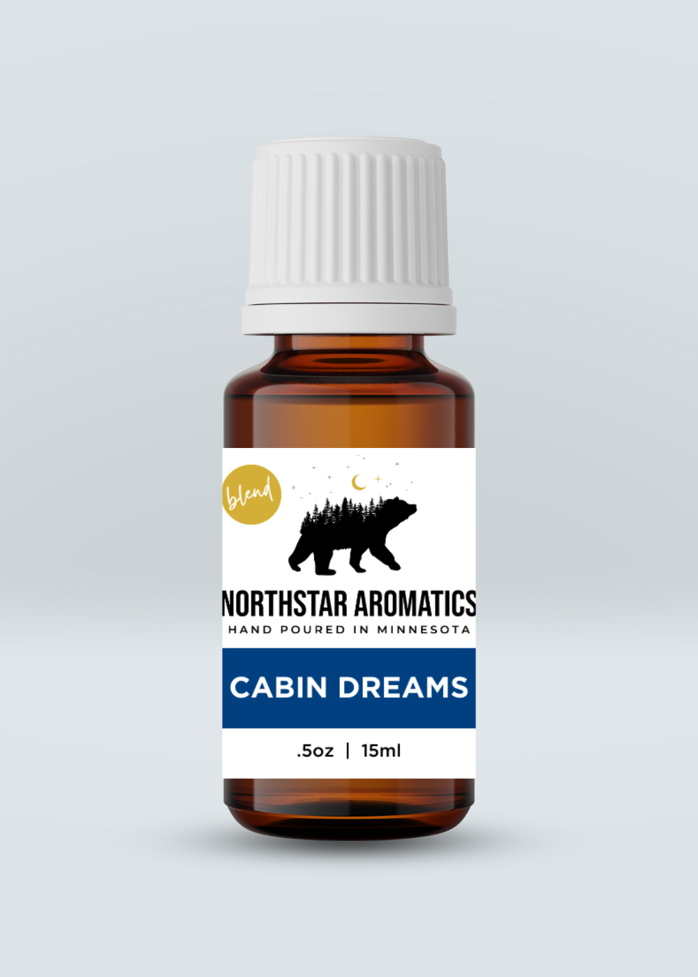 Cabin Dreams Blend essential oil bottle by Northstar Aromatics with woodsy, pine scent for home and office spaces.