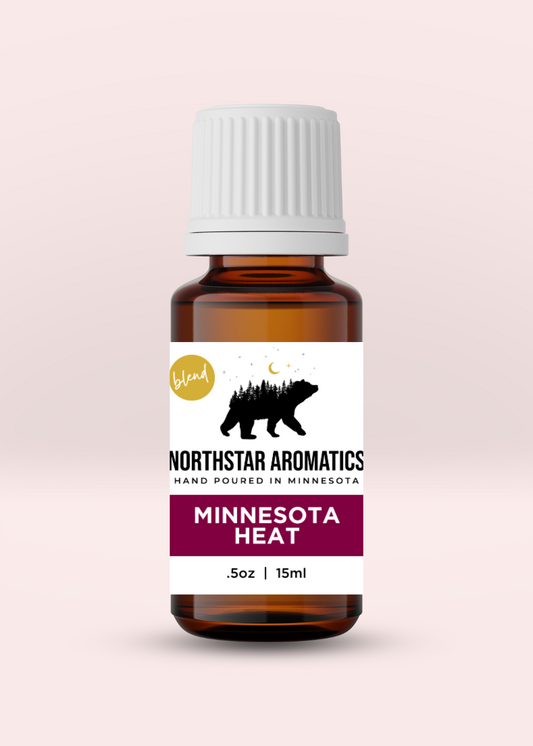 Minnesota Heat Blend essential oil bottle for warming, pain relief, muscle support, and relaxation, 15ml.