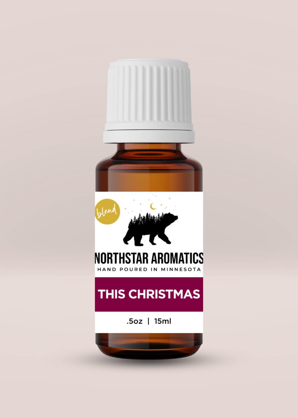 Bottle of This Christmas blend essential oil by Northstar Aromatics in 15ml amber glass for holiday diffusion.