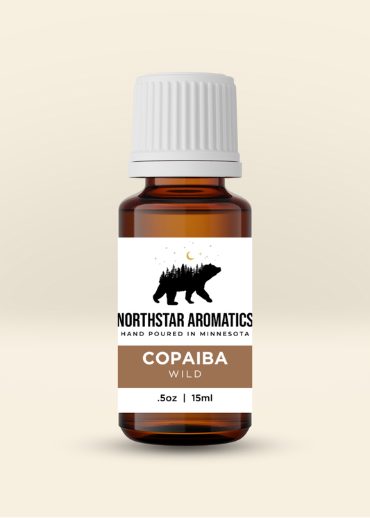 Copaiba Balsam, Wild essential oil bottle by Northstar Aromatics for warming and relaxing sore muscles.