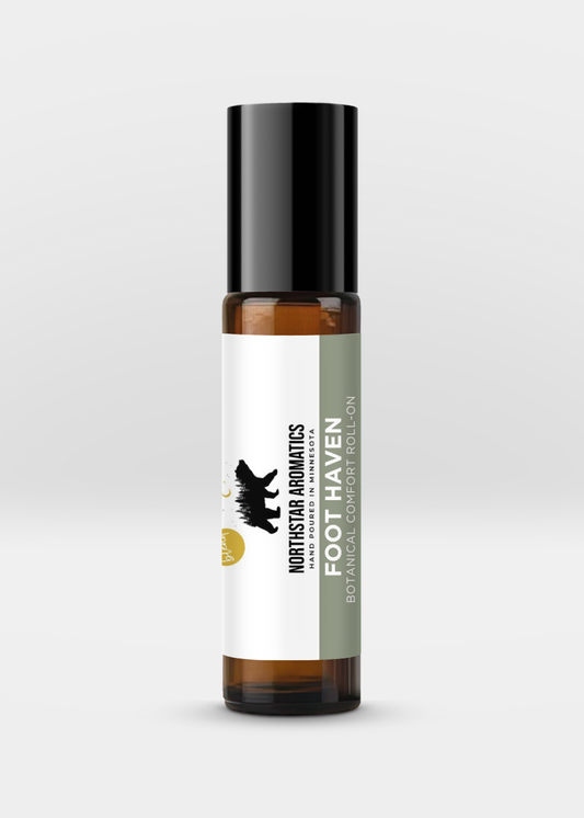Foot Haven essential oil roll-on by Northstar Aromatics in amber glass bottle with black cap on neutral background