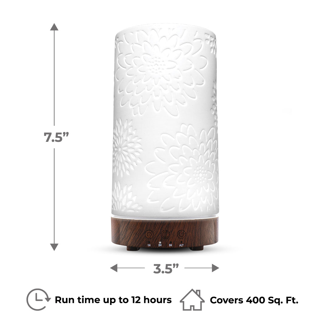 Joy Diffuser handcrafted with white flower design and wood base, perfect for aromatherapy up to 12 hours.