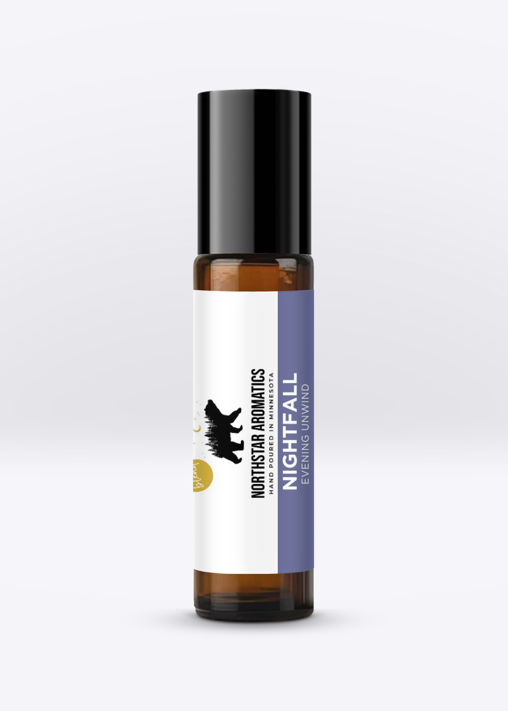 Nightfall essential oil roll-on by Northstar Aromatics in amber glass bottle with black cap on neutral background
