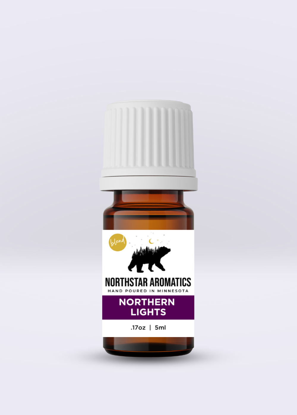 Amber glass bottle of Northern Lights essential oil blend with a white cap and label featuring a bear silhouette and purple accent.