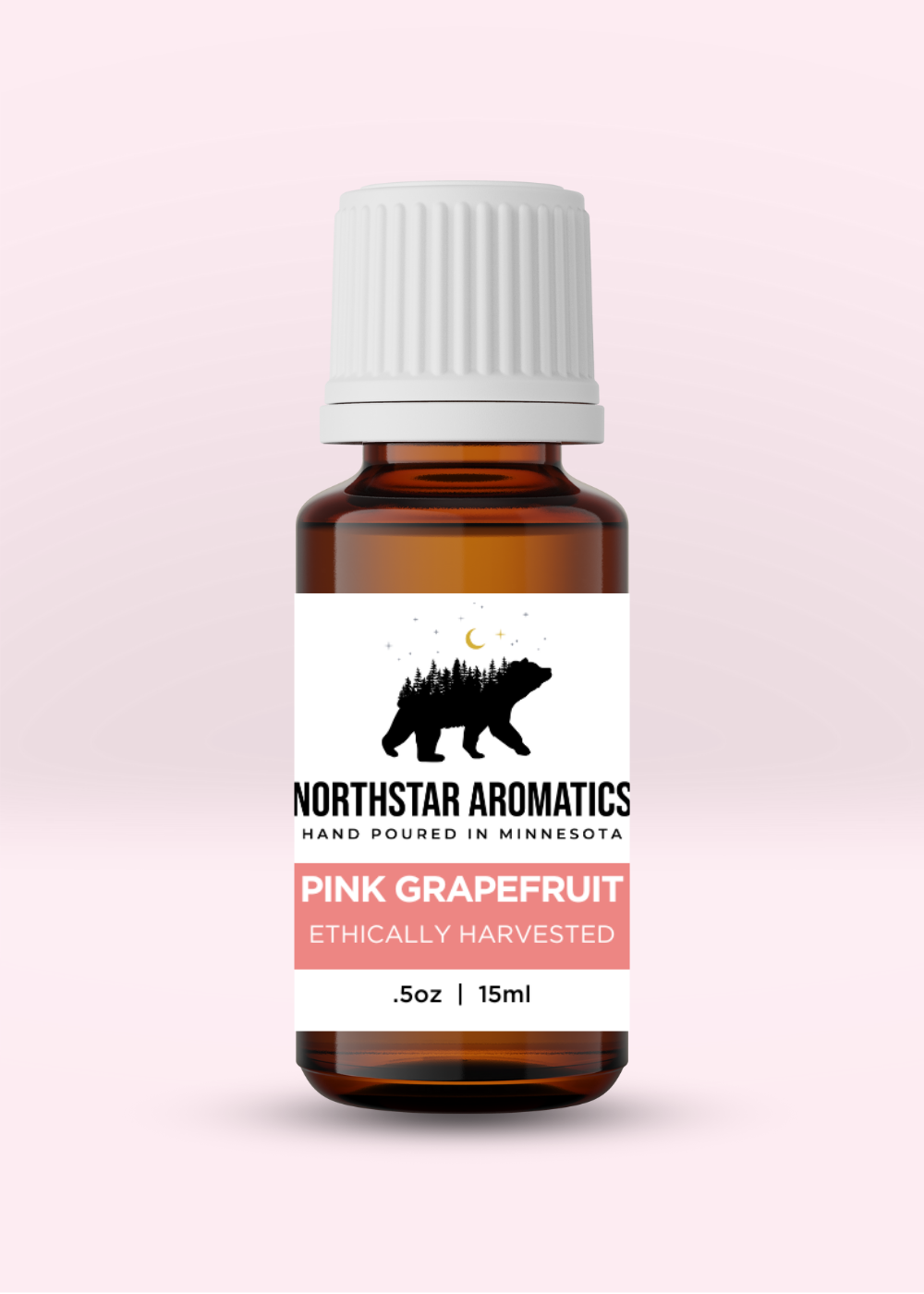 Amber glass bottle of Pink Grapefruit essential oil by Northstar Aromatics, 15ml, ethically harvested.