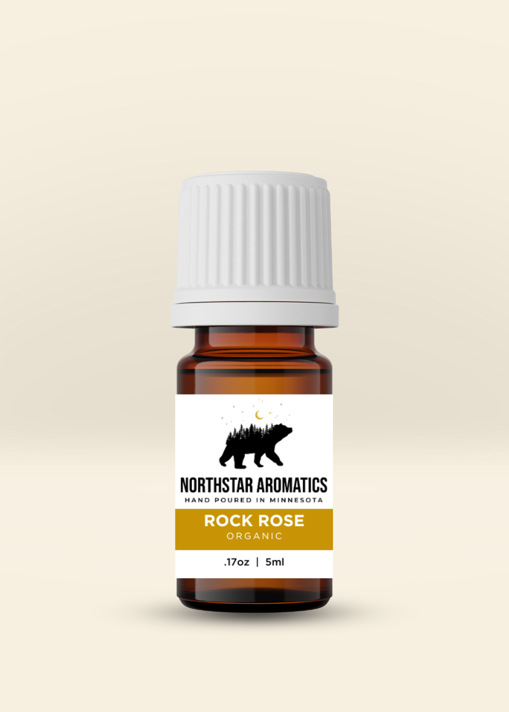 Rock Rose organic essential oil by Northstar Aromatics in amber bottle with white cap and label.