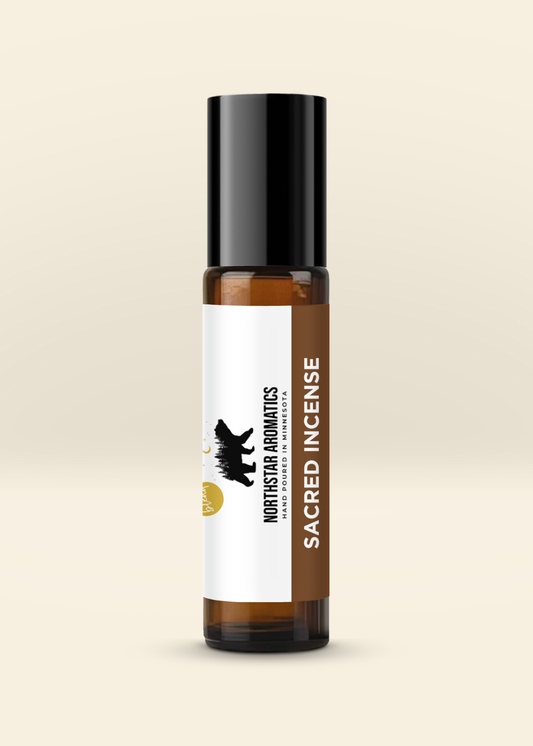 Amber roll-on bottle labeled Sacred Incense with black cap and white and brown label featuring Northstar Aromatics bear logo
