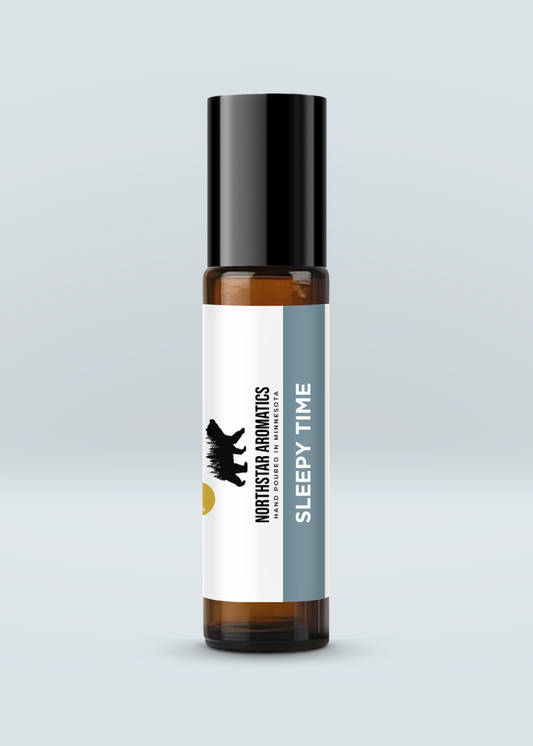 Amber roll-on bottle of Sleepy Time blend designed to promote relaxation and emotional grounding on pale background