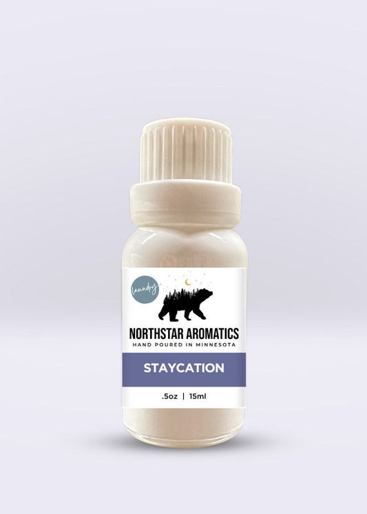Staycation Laundry Oil by Northstar Aromatics with fresh floral scent in a 15ml white bottle.