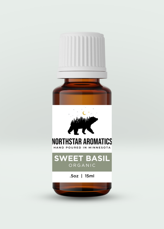 Sweet Basil Organic essential oil bottle by Northstar Aromatics, 15ml amber glass with white cap.