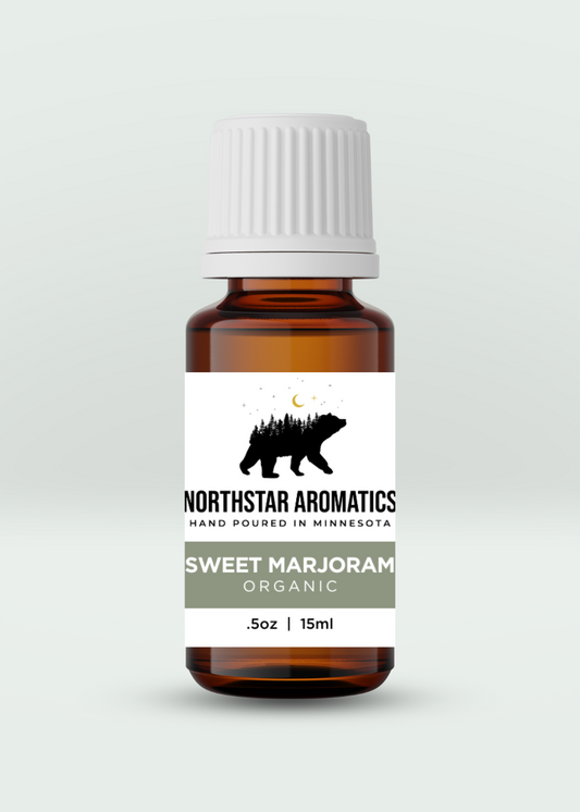 Amber glass bottle of Sweet Marjoram - Organic essential oil by Northstar Aromatics, 15ml for calming and relief.