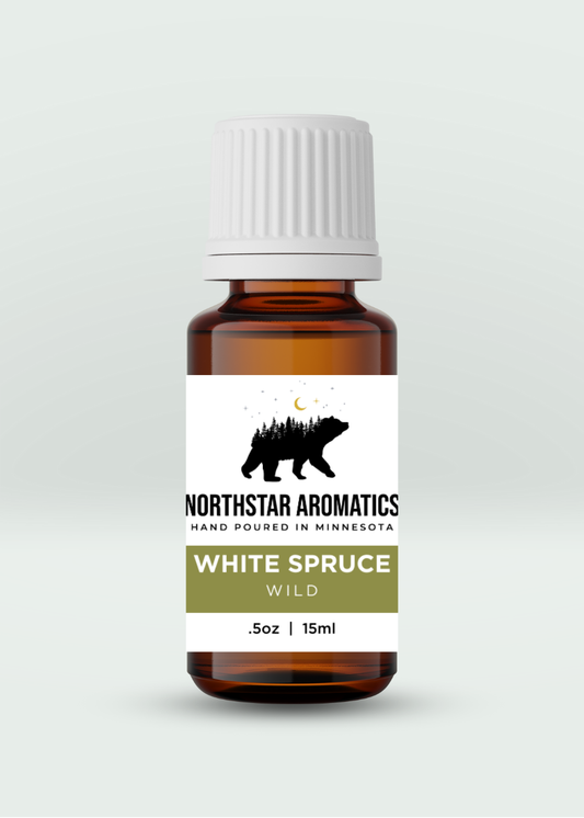 Amber essential oil bottle labeled White Spruce by Northstar Aromatics, 15ml for respiratory support and muscle relief.