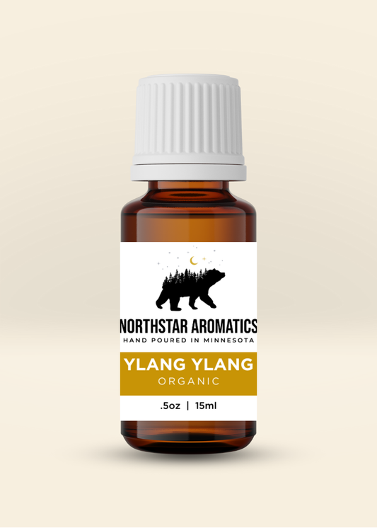 Ylang Ylang essential oil bottle by Northstar Aromatics in 15ml amber glass packaging with white cap and label.