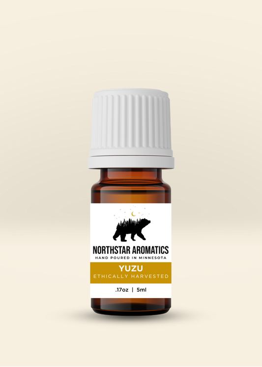 Yuzu essential oil bottle by NorthStar Aromatics with citrus, floral, and grounding scent in a 5ml amber glass vial.