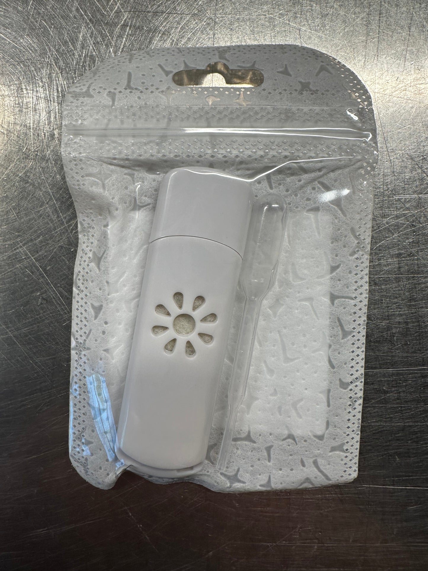 Mini Mister Travel Diffuser in clear resealable packaging for portable essential oil aromatherapy use.