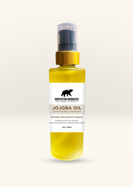 Jojoba Oil 2oz bottle with pump dispenser, natural moisturizer and carrier oil for skin and hair care.