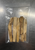 Palo Santo Smudge Sticks packaged in a clear resealable bag on a metal surface, natural cleansing wood sticks.