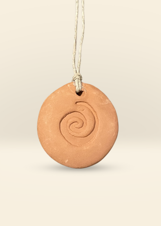 Terra Cotta Aromatherapy Diffuser handmade clay pendant with spiral design for essential oils and scent diffusion.