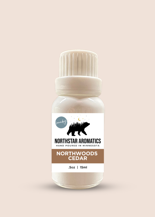Northwoods Cedar Laundry Oil by Northstar Aromatics, warm woods leather dryer ball oil for cozy laundry.
