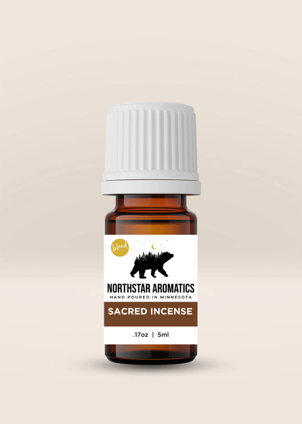 Amber glass bottle of Sacred Incense Blend by Northstar Aromatics with white cap on beige background
